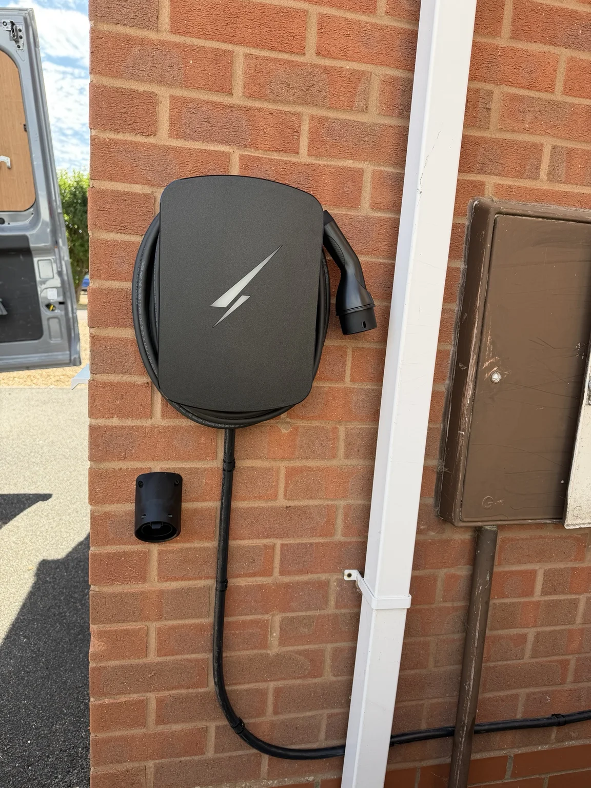 EV charger installed on a brick wall