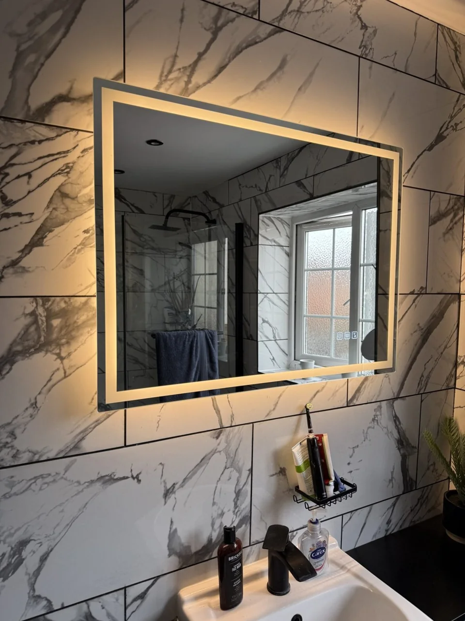 Illuminated bathroom mirror and lighting